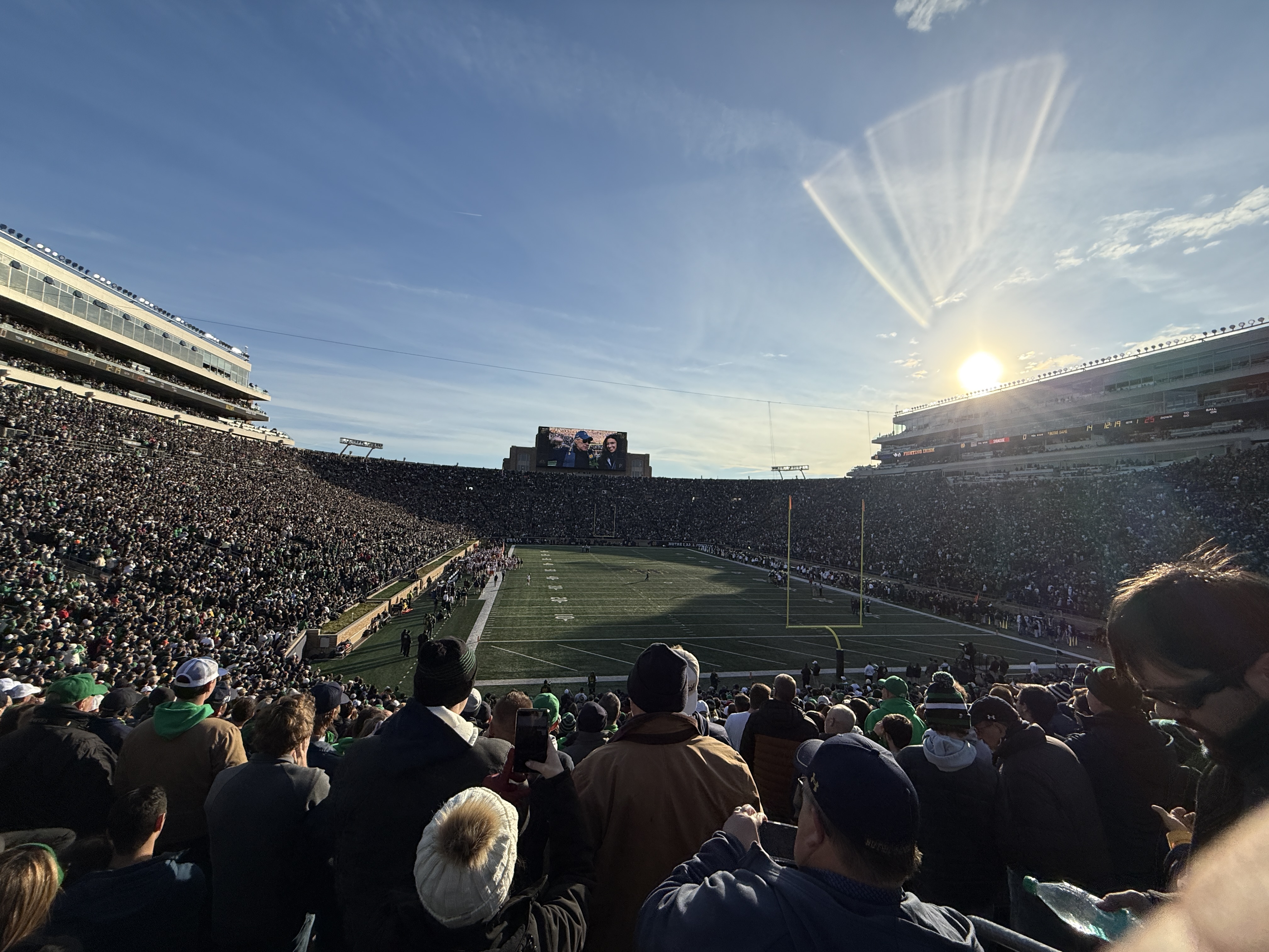 Pregame stadium beneath a setting sun