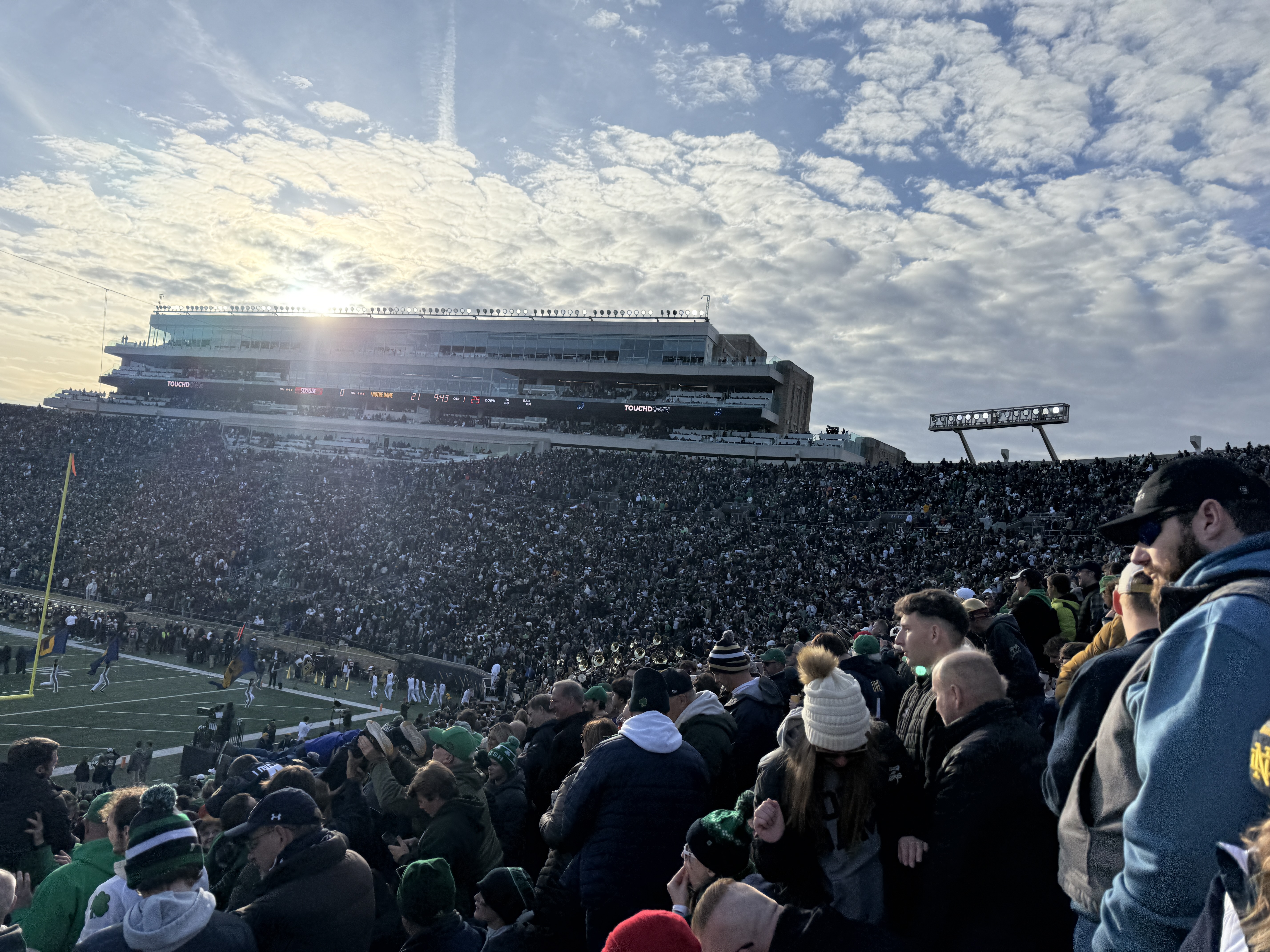 Sunlight spreading across a packed Notre Dame football stadium