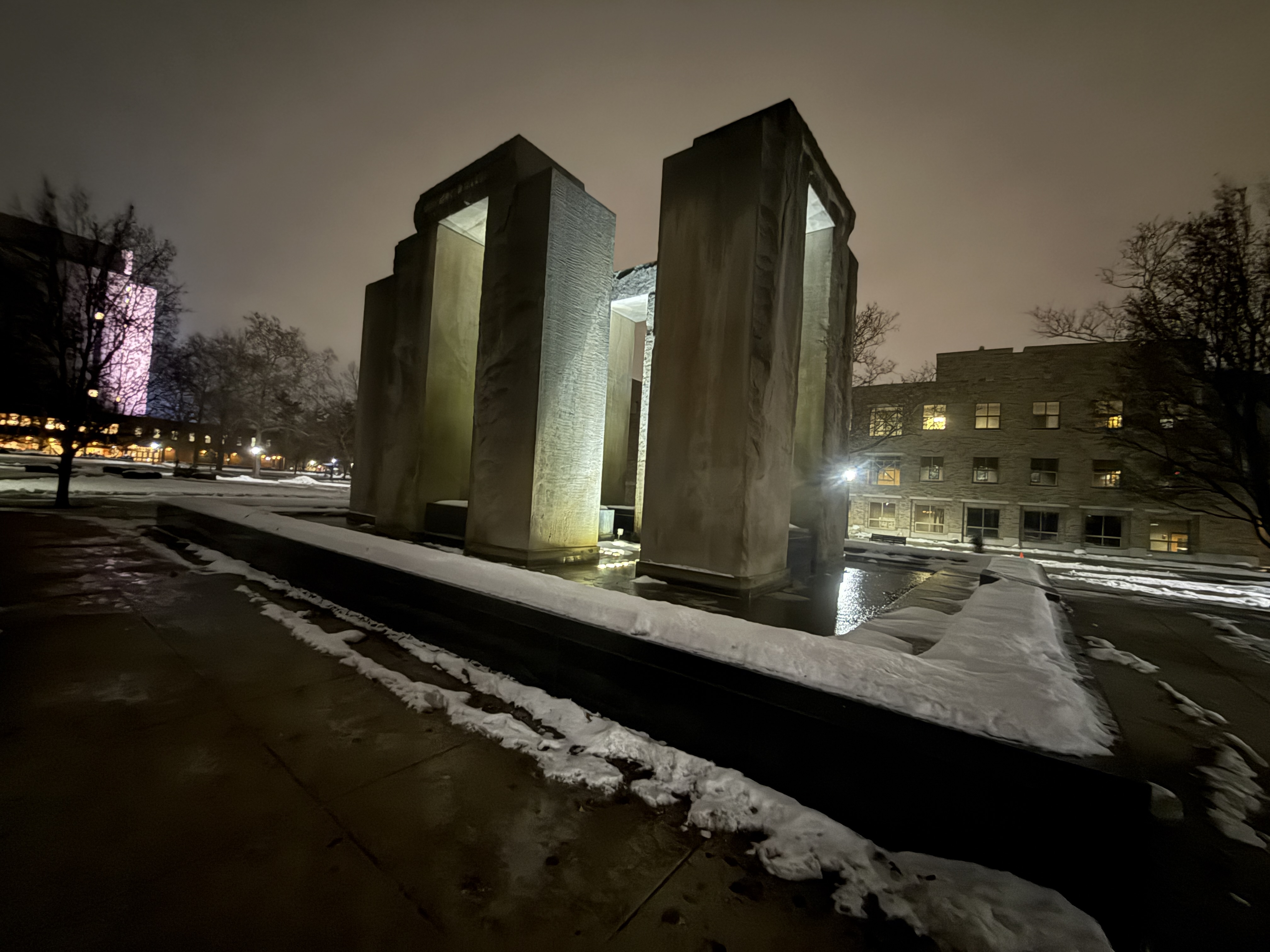 Snow-covered campus at night