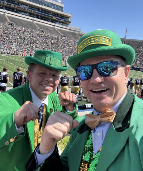 Traynor Jennings, the Irish Train, posing with a fellow Notre Dame fan inside the stadium